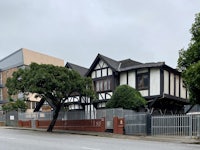 a house with a fence in front of it